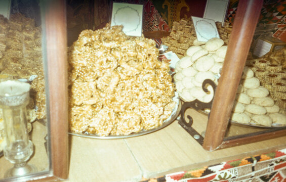 Film image of Arabic pastries displayed in plates