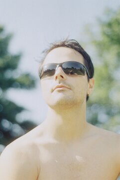 Topless Man in Sunlight at the Park