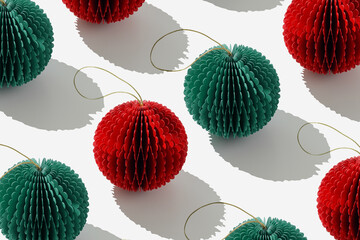 Minimal pattern of red and green paper Christmas ornaments xmas balls on light white, trendly...