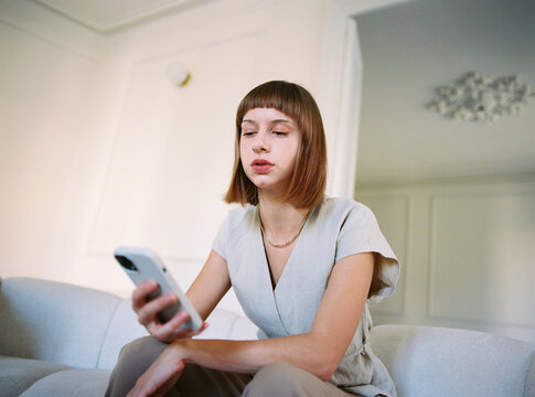 Woman engrossed in smartphone engaging with social media