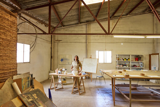 Creative artist working in a spacious studio setting