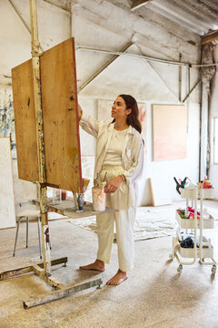 Artist creates original artwork in a spacious studio