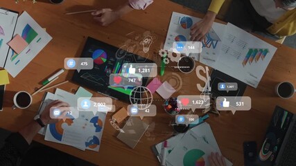 A diverse group of professionals working together in a modern office environment, analyzing data charts and social media engagement to develop a marketing strategy. Raster - Powered by Adobe