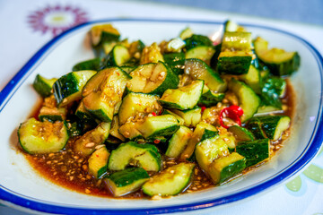 A plate of tangy, spicy, and crunchy cold cucumber salad