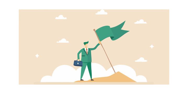 Businessman plants flag on mountain peak celebrating achievement