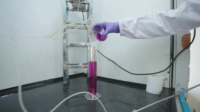 Close-Up of Lab Worker Transferring Coloured Chemical Scientist Handling Bright Solution During Experiment