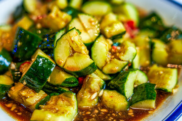 A plate of tangy, spicy, and crunchy cold cucumber salad