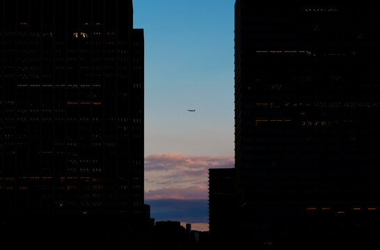 Sky Window: Airliner Flying Between Skyscrapers.