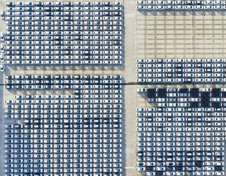 Aerial View of Massive Car Parking Lot with White Cars