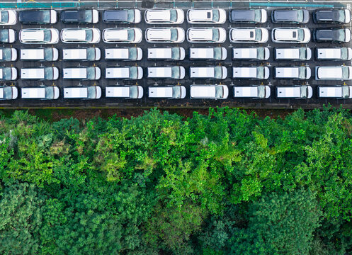 Aerial View New Cars Parking Lot And Green Forest