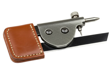 Leather skiving tool with sharp blade and brown cover on isolated background