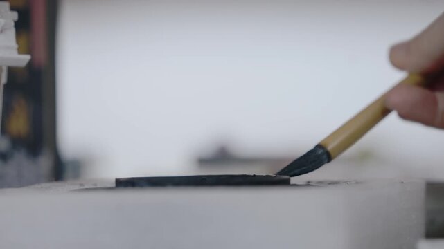 Weathered Black Strip on White Surface with Harbor Background
