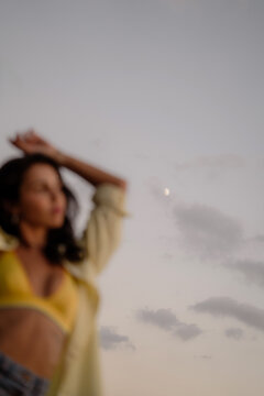 Unfocused woman dancing in the moonlight