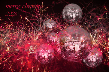 Party lights disco ball with fireworks - Christmas decoration on abstract background -