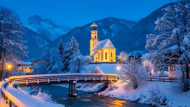 Illuminated baroque church in a snowy alpine village at twilight with a snowcovered bridge over a stream and mountains in the background - Powered by Adobe