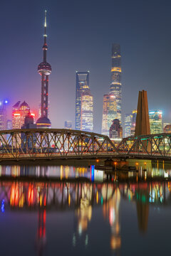 The night view of the modern city skyline and the external Baidu Bridge in Shanghai, China, on November 20, 2025
