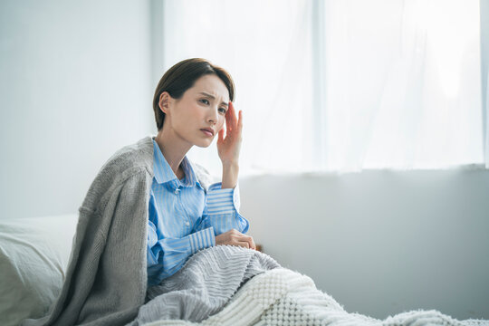 体調不良の女性