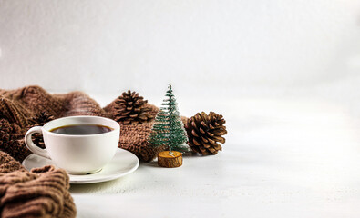 Cozy winter Coffee with pine cones and Chistmas tree decorationv