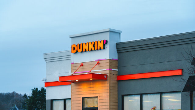 New Hartford, NY - Nov 29, 2025: Close-up view of Dunkin' Donuts, a multinational coffee and doughnut chain headquartered in Canton, Massachusetts, with more than 14,000 restaurants worldwide