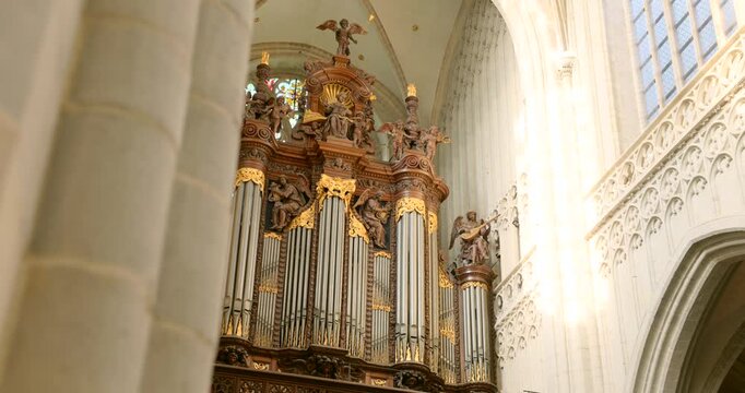 Ornate pipe organ standing inside the historic Cathedral of Our Lady playing music