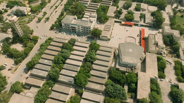 Aerial view showcases NED University of Engineering and Technology in Karachi Pakistan highlighting the buildings roads and greenery within the urban landscape