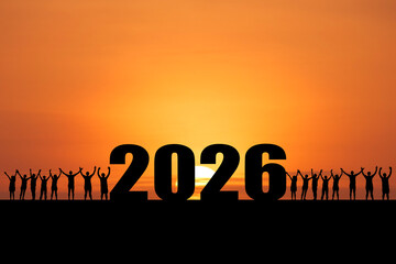 Silhouette of a crowd celebrating the arrival of the year 2026 at sunset © Stock4u2024 