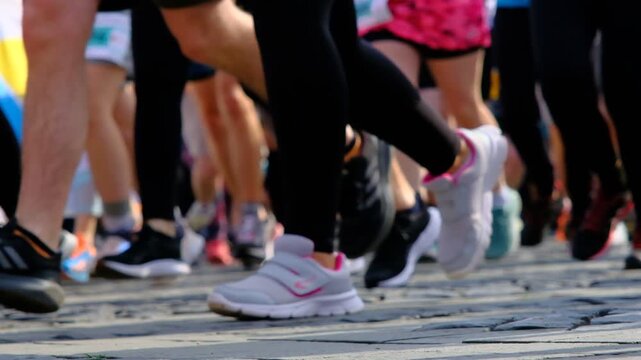 People, legs and running on road in exercise at the marathon