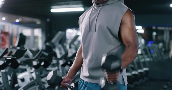 Man, arms or weightlifting with dumbbells in gym for bodybuilding exercise or training. Active, male person or muscular bodybuilder with weight for bicep curls, reps or fitness workout in health club