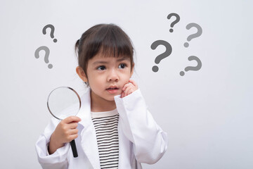 Curious little girl holding a magnifying glass and thinking with question marks around her, symbolizing learning, inquiry, problem-solving, child education, imagination, and creative exploration.