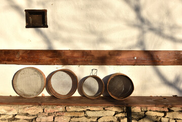 Rustic sieves on an outdoor shelf