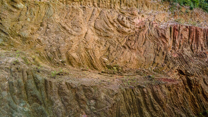 Drone view of rock formations and moss texture in quarry. Nature and environment texture from above