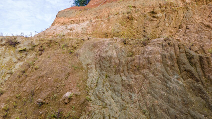 Drone view of rock formations and moss texture in quarry. Nature and environment texture from above