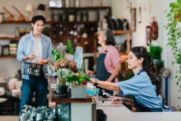Asian Mother and Daughter Assist Male Customer at Ceramic Shop