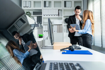 Diverse businessman and woman working and collaborating in modern office. 