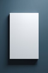 A blank canvas positioned against a dark blue wall, ready for creative expression and artistic endeavors to come alive.