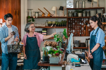 Asian Mother and Daughter Assist Male Customer at Ceramic Shop
