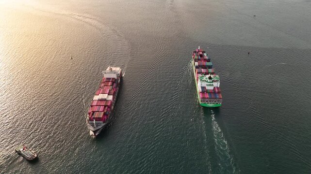 Two Large Cargo Ship carrying container and running in Opposite direction for export import Cargo at sea sunset ocean concept technology transportation logistics. ship carrying container logistics.