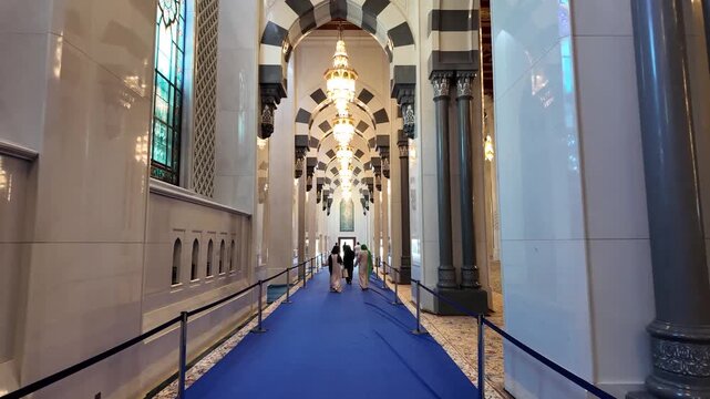 Walking inside the Sultan Qaboos Grand Mosque in Muscat, Oman