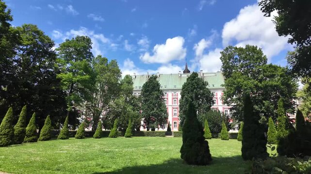 Walking in the park around Parish Church of St. Stanislaus (Fara Church) in poznan, Poland
