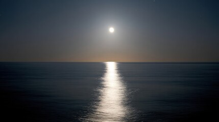 Obraz premium Photograph of a beautiful sunset over the ocean. the sky is a deep blue color with a few wispy clouds.