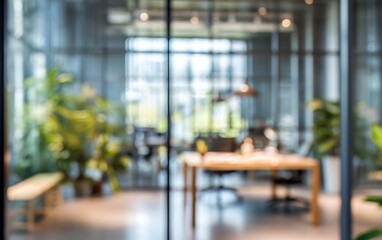 Abstract office interior background. Blurry office space. Modern workspace design. Glass walls, blurred furniture, plants. Natural light, commercial building, business concept, indoor. High quality