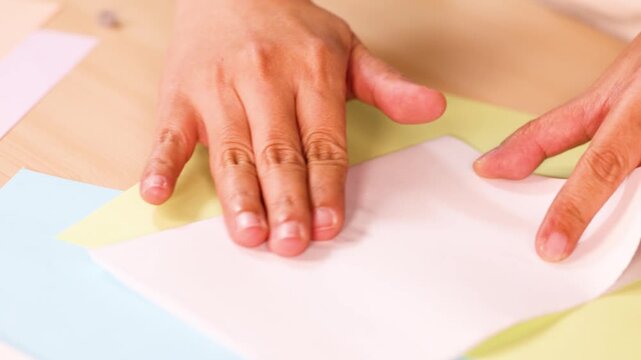 Hands Creating Colorful Acrylic Paint Art on Paper