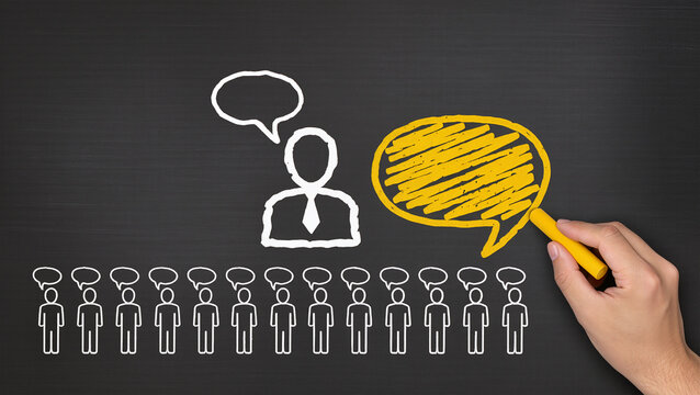 Business communication concept and Businessman drawing speech balloons on chalkboard