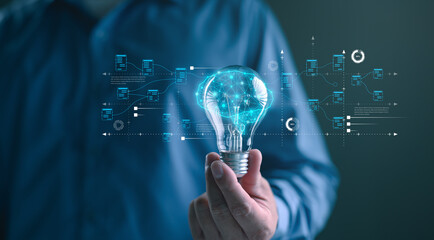 Hand holding a glowing light bulb with digital brain and data flow interface, symbolizing artificial intelligence, big data innovation, creative technology, and futuristic digital transformation.