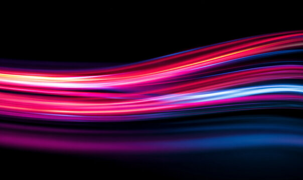 High-speed neon lines streak across dark city streets. Bright glowing trails follow precise line paths. The effect forms a futuristic motion network. 