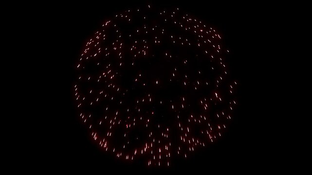 Perfect red spherical firework bursts against black background. Ideal for New Year or 4th of July celebration overlays. Isolated element