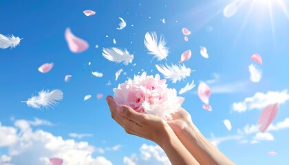 祝福の光: 青空の下、女性の手で天に捧げられるピンクの大きな花