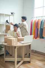 Young Entrepreneurs Diligently Packing Orders and Organizing Inventory in Bright