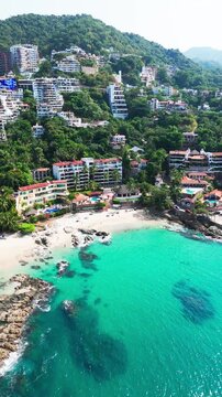 Aerial view of tropical conchas chinas beach with turquoise water in puerto vallarta, mexico