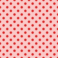 Red polka dot pattern on pink background with cheerful and playful design